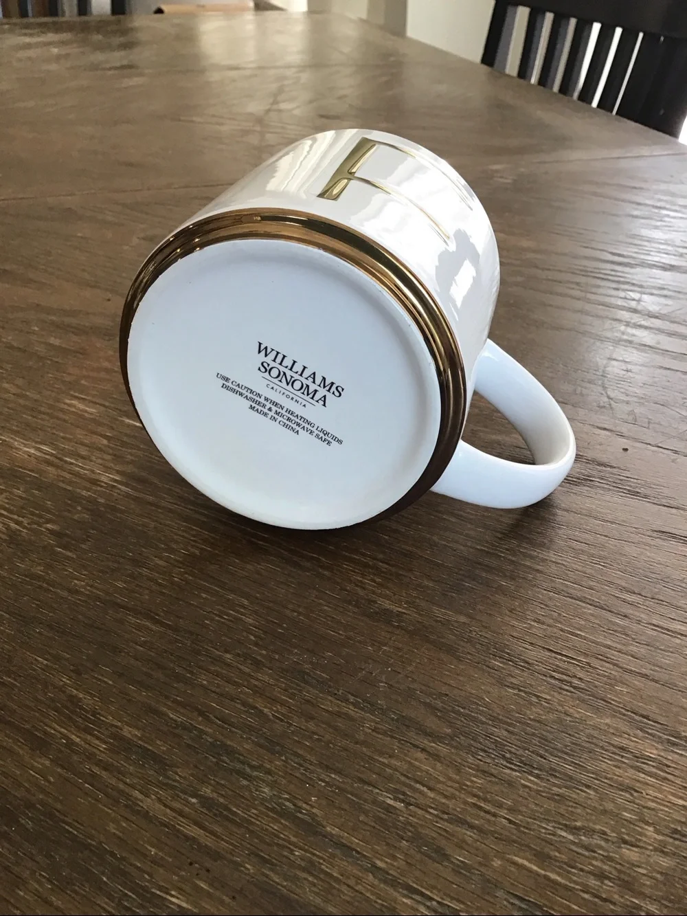 Williams Sonoma white ceramic mug features a gold-painted initial 